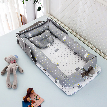Portable und faltbare Babybett mit Kissen